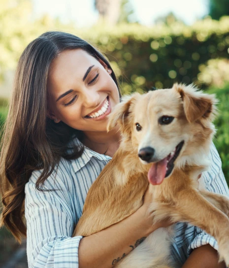 Woman holding a dog